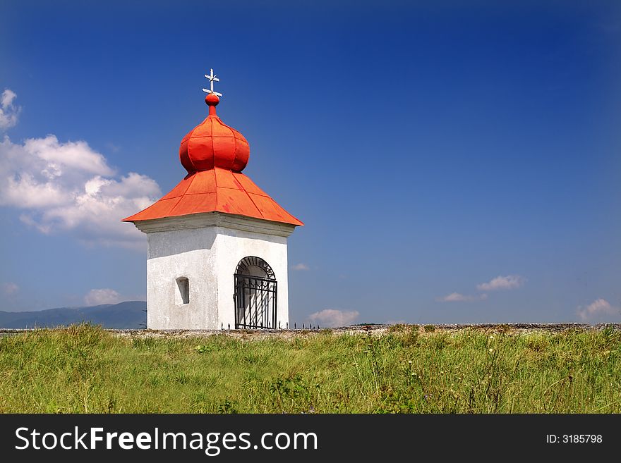 Rustic Christian chapel with red roof. Rustic Christian chapel with red roof