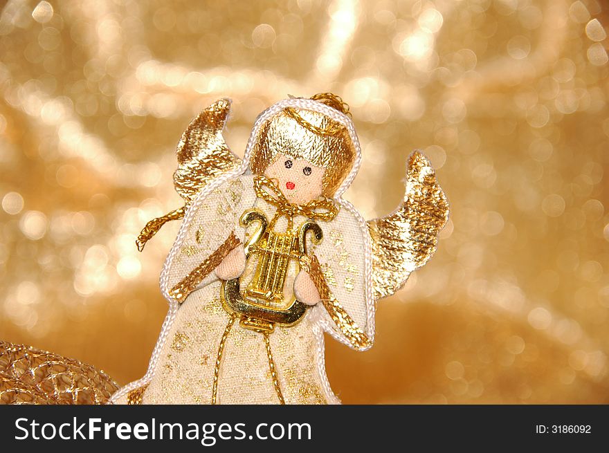 Christmas angel toy with golden decoration