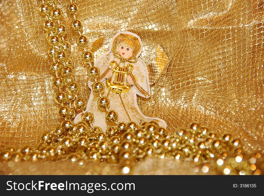 Christmas angel toy with golden decoration