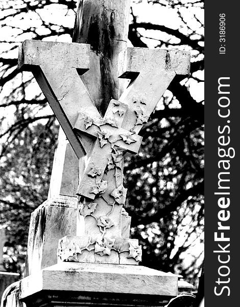 This is a black and white view of a Y with a Cross and ivy/vines at the Laurel Hill Cemetary.  I go there at least once a year with a bunch of goth mommies and daddies and their children on the Kinderbats picnic. This is a black and white view of a Y with a Cross and ivy/vines at the Laurel Hill Cemetary.  I go there at least once a year with a bunch of goth mommies and daddies and their children on the Kinderbats picnic..