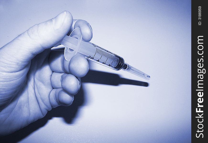 Hand end syringe ready to injection