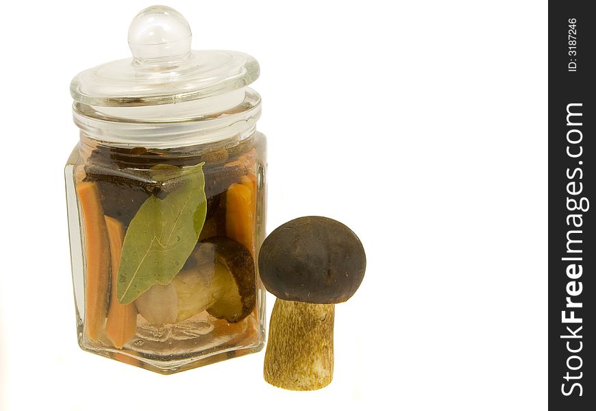 Mushroom in the jar on a white background