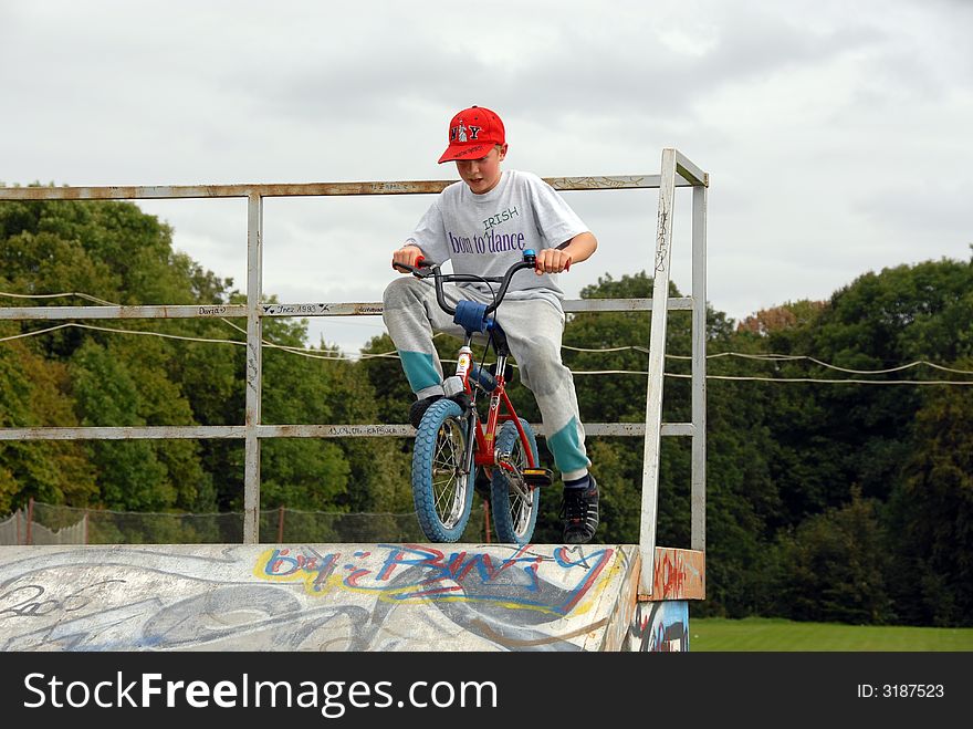 Young boy rides bicycle