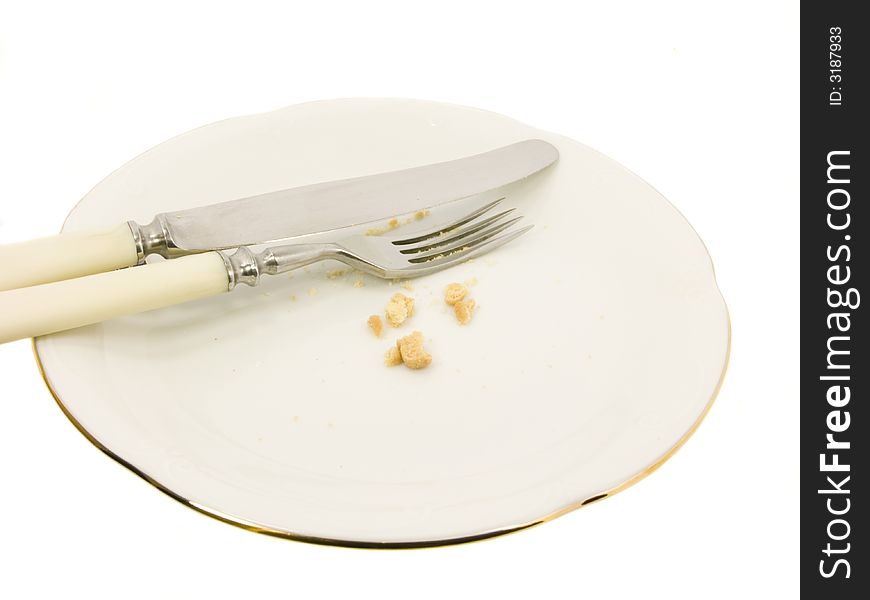 Fork and knife on white plate