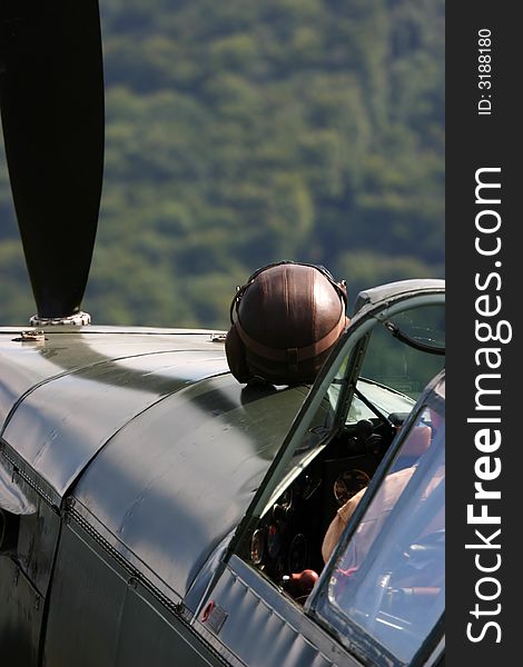 Helmet on a vintage warbird ready for take-off.