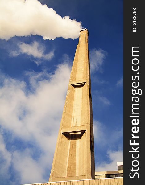 Big chimney, smoke, blue sky