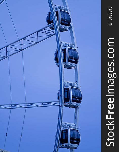 Ferris wheel on a blue background