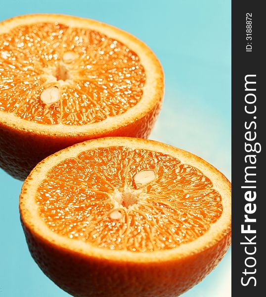 The cut orange on a blue background