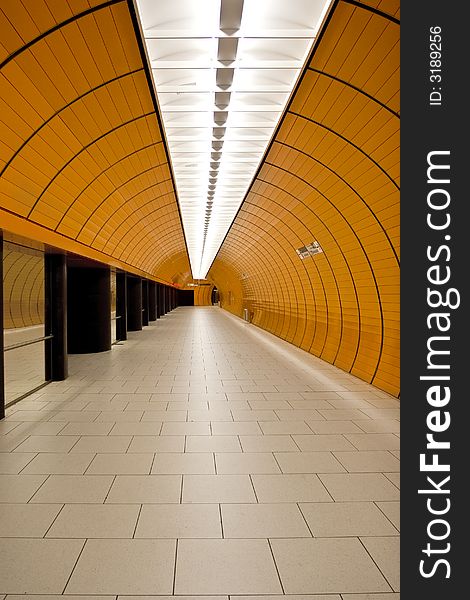 An underground metro access tunnel in orange. An underground metro access tunnel in orange