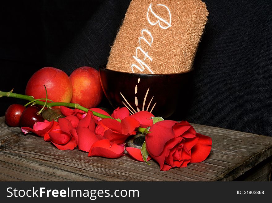 Spa stones, fruit and roses on black background. Spa stones, fruit and roses on black background