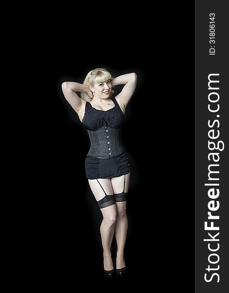Portrait of a beautiful young woman with blond hair and brown eyes shot in a black corset. Portrait of a beautiful young woman with blond hair and brown eyes shot in a black corset.