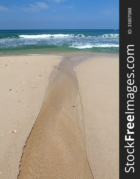 Unique River to The Sea. The metaphor for return to the source, found in Siung Beach, Indonesia