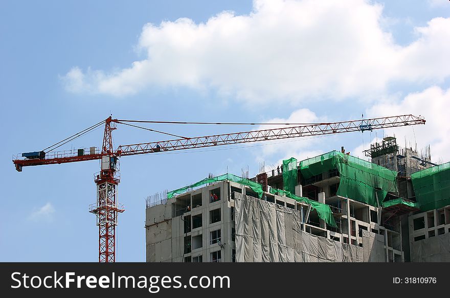 Construction site with crane on sky background