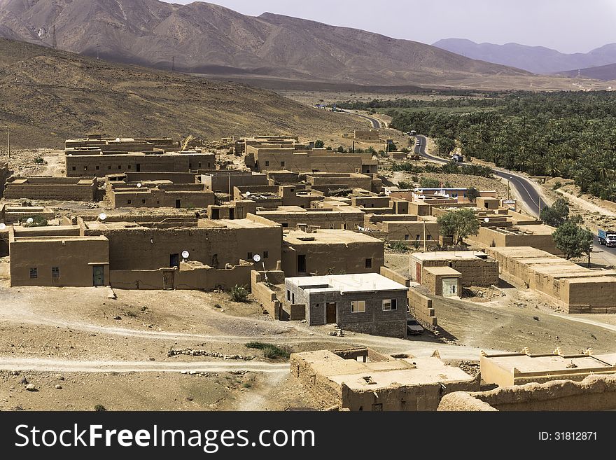 The way from Quarzazate to Zagora , over the mountains from the High Atlas in Morocco. Houses from a kasbah. The way from Quarzazate to Zagora , over the mountains from the High Atlas in Morocco. Houses from a kasbah.