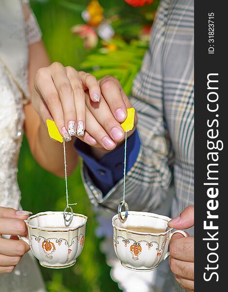 Wedding rings on the tea bsg's thread