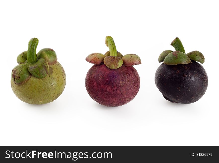 Mangosteen in three stages of ageing, green red and violet