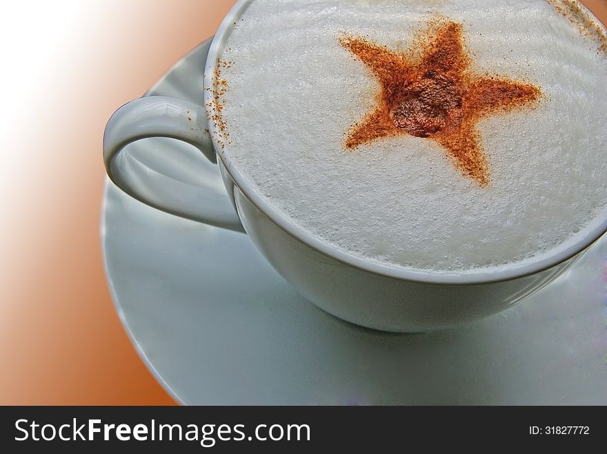 Close up of coffee cup with ornament made of cinnamon. Close up of coffee cup with ornament made of cinnamon