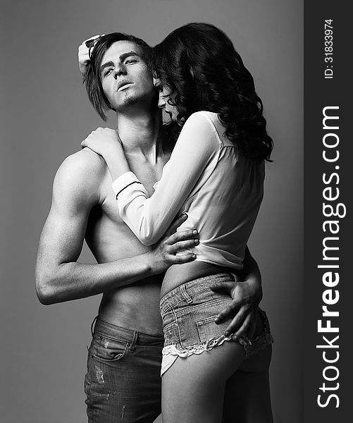 Sensuality. Love. Young Man and Woman in Cuddle