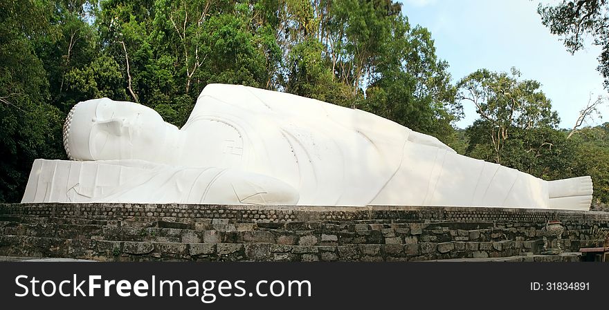 Lying Buddha statue on the mountain Ta Ku. Vietnam