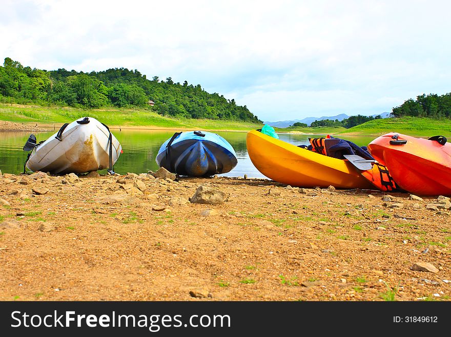 Kayaks, canoe  on the edge of the water in Lake