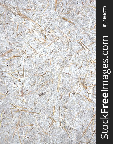Natural paper background with oat straw and white fibers. Natural paper background with oat straw and white fibers.
