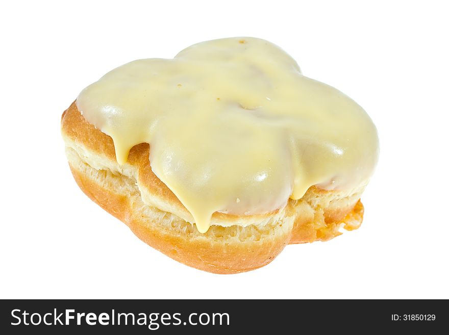 Donut with banana glaze on white. Donut with banana glaze on white