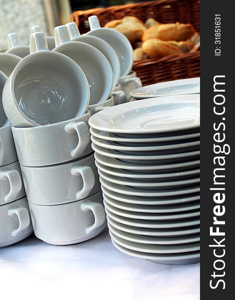 white plates and soup cups