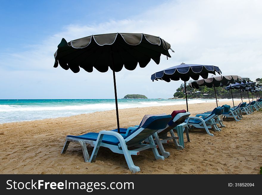 Chairs & umbrellas on the beach at Phuket, Thailand. Chairs & umbrellas on the beach at Phuket, Thailand