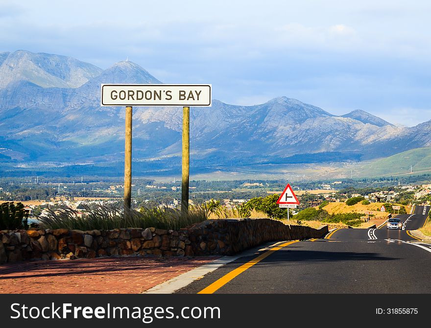 Road sign with the caption of Gordon's Bay. Road sign with the caption of Gordon's Bay