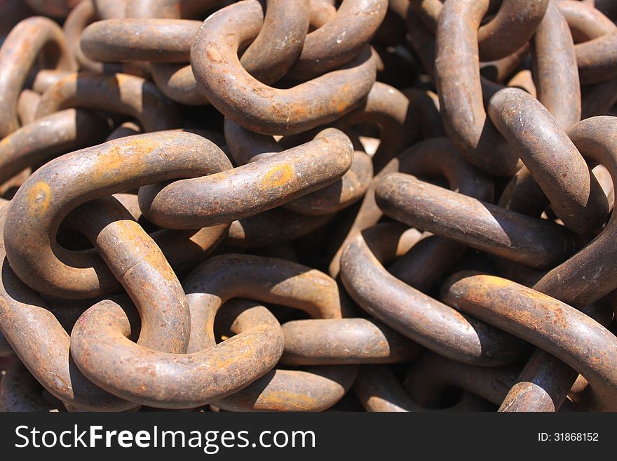 Macro rusty brown links of chain. Macro rusty brown links of chain