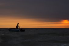 Silhouette Of Fisherman Stock Images
