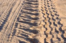 Tire Tracks On A Sandy Road Stock Photography