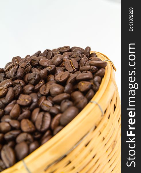 Close up coffee bean in basket isolate on white background