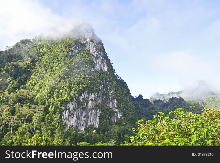 Limestone mountain surrounded by tropical forests of Thailand. Limestone mountain surrounded by tropical forests of Thailand.