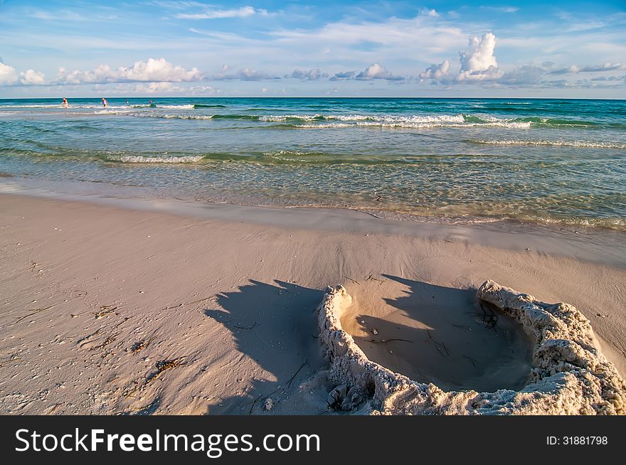 Sand structures on beach near ocean waves