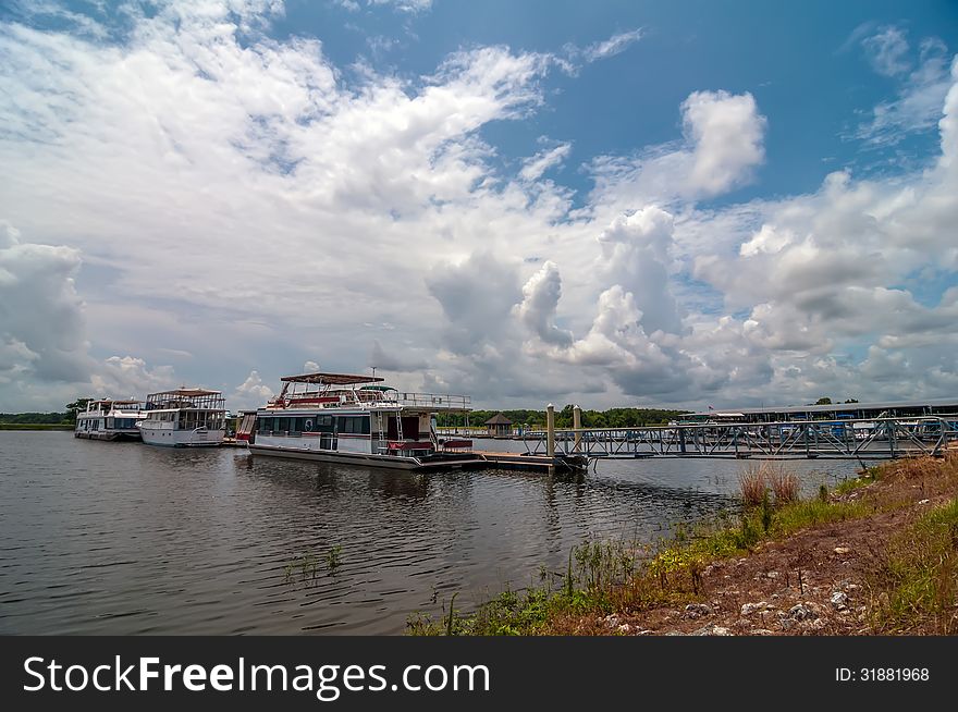 House boats parked at floating dock marina
