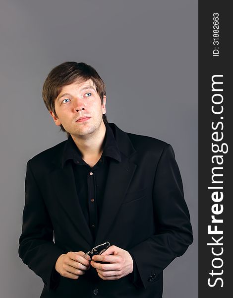 Portrait of intelligent man in a suit on gray background. Portrait of intelligent man in a suit on gray background