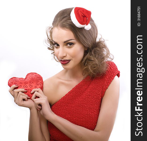 Pretty sexy woman in santas red hat isolated