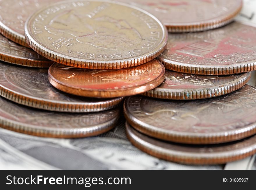 Close up of coins on the dollar bill. Close up of coins on the dollar bill