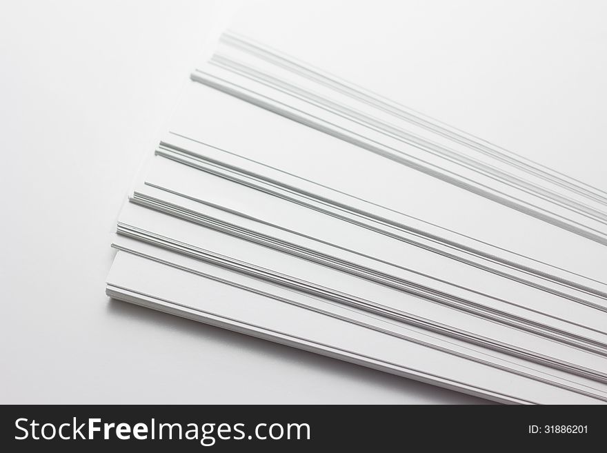 Close Up Of Stack Of Papers On White Background