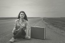 Girl Siting On Road With Suitcase Looks For Fellow Traveler Stock Images Girl Siting On Road With Suitcase Looks For Fellow Traveler Stock Images