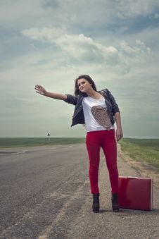 Girl Standing On Road With Suitcase Looks For Fellow Traveler Royalty Free Stock Photography Girl Standing On Road With Suitcase Looks For Fellow Traveler Royalty Free Stock Photography
