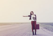 Girl Standing On Road With Suitcase Looks For Fellow Traveler Stock Photography Girl Standing On Road With Suitcase Looks For Fellow Traveler Stock Photography