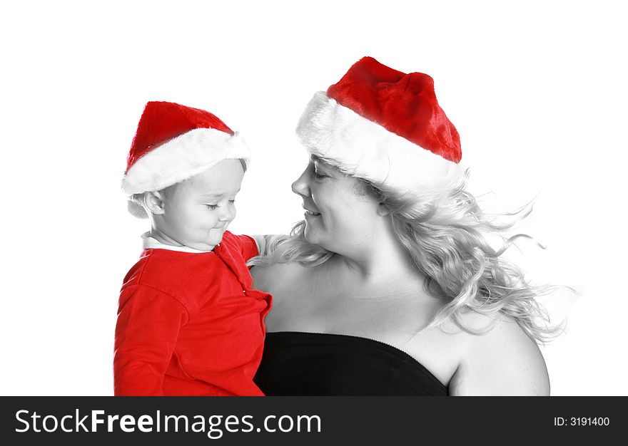 Mother and son getting ready for christmas day. Wearing their red santa hats. Mother and son getting ready for christmas day. Wearing their red santa hats.