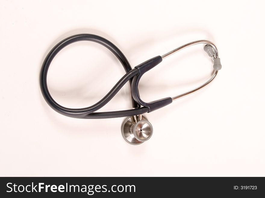 Stethoscope laying on a white background