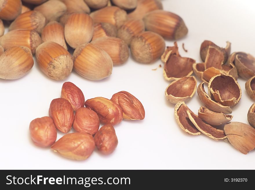 Food background with whole and cracked hazelnuts. Food background with whole and cracked hazelnuts