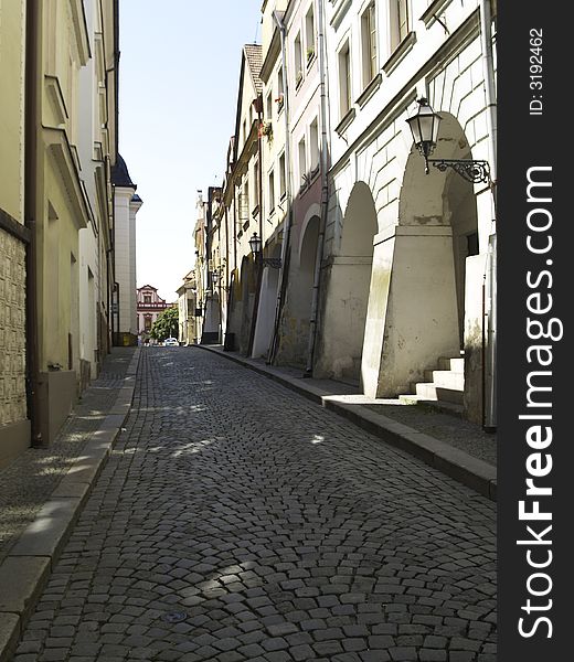 Old sett street in old town. Hradec in Czech Republic.