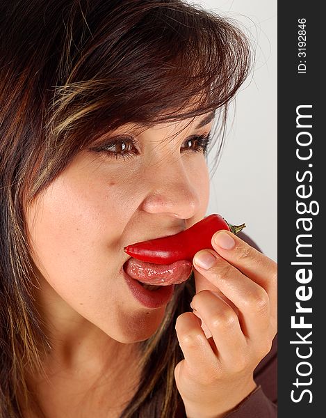 Woman Eating Red Pepper