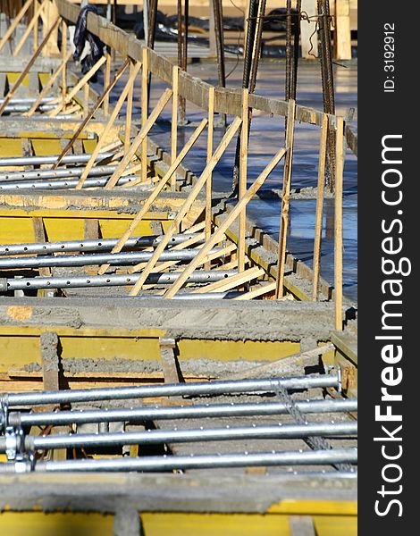 Close up at a part of construction site with some supports. Close up at a part of construction site with some supports