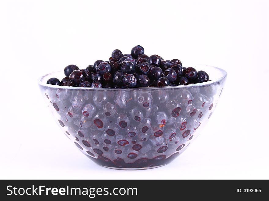 Blueberry close up isolated on white in glass. Blueberry close up isolated on white in glass